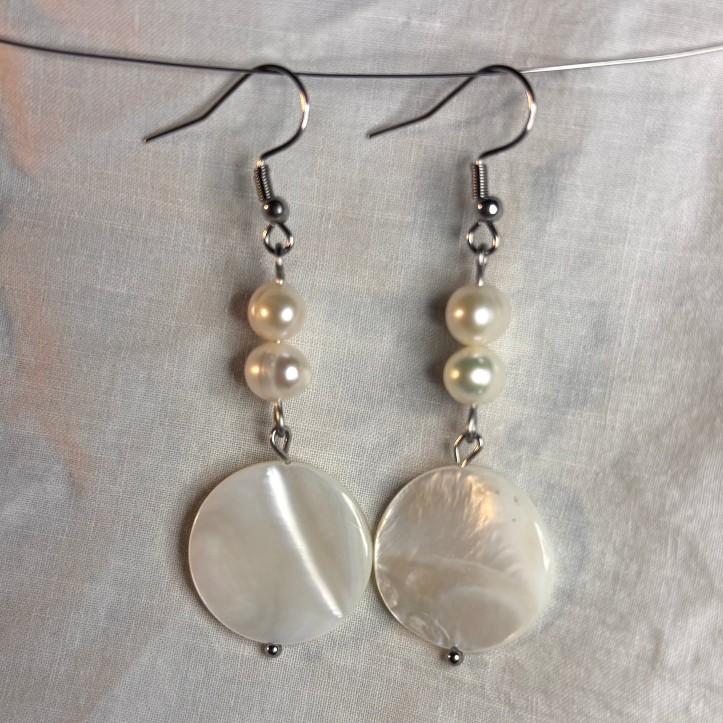 shell disk and pearl earrings