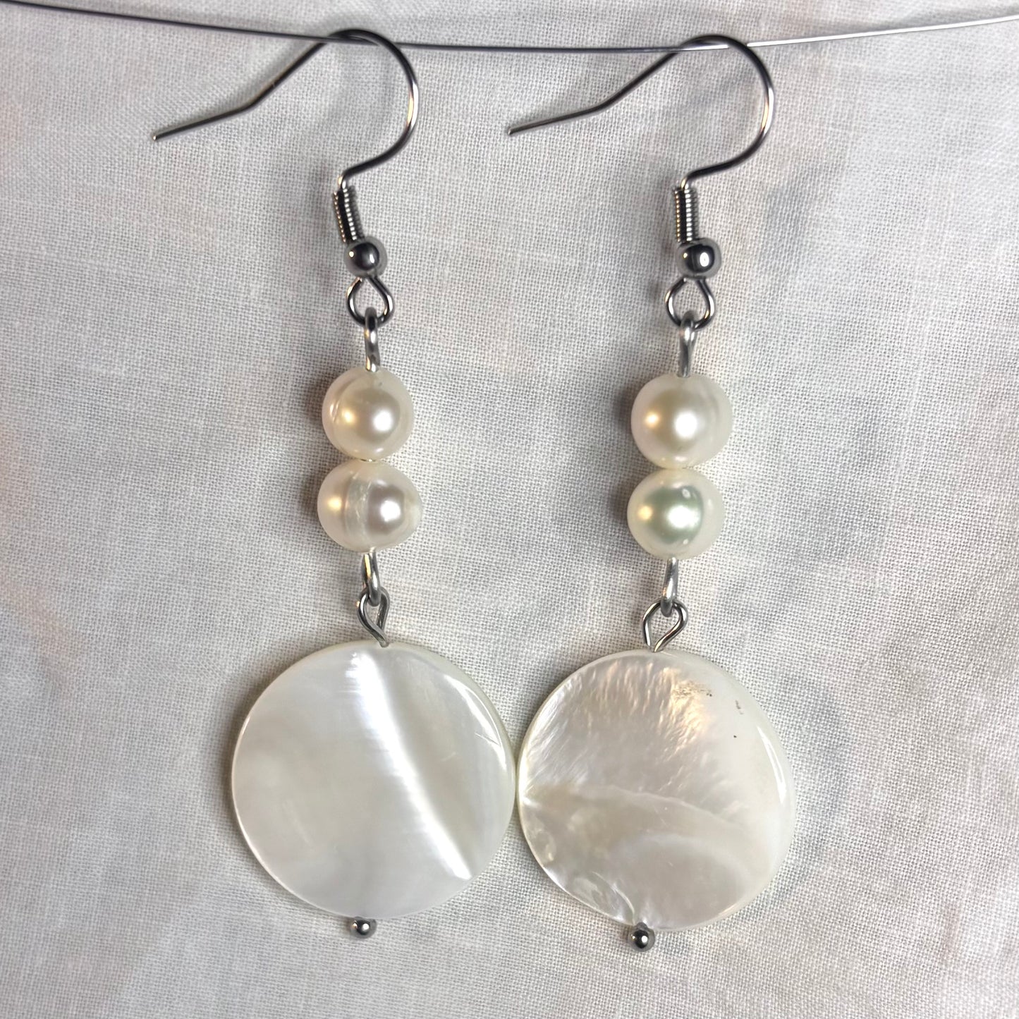 shell disk and pearl earrings