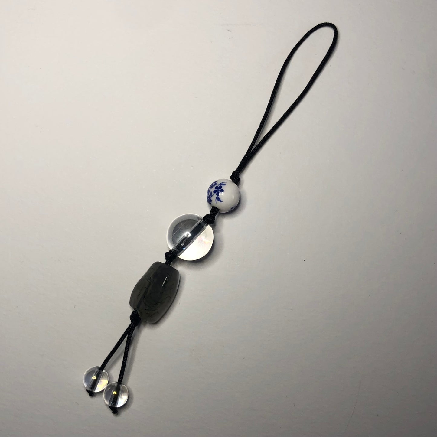 Beaded cord charm