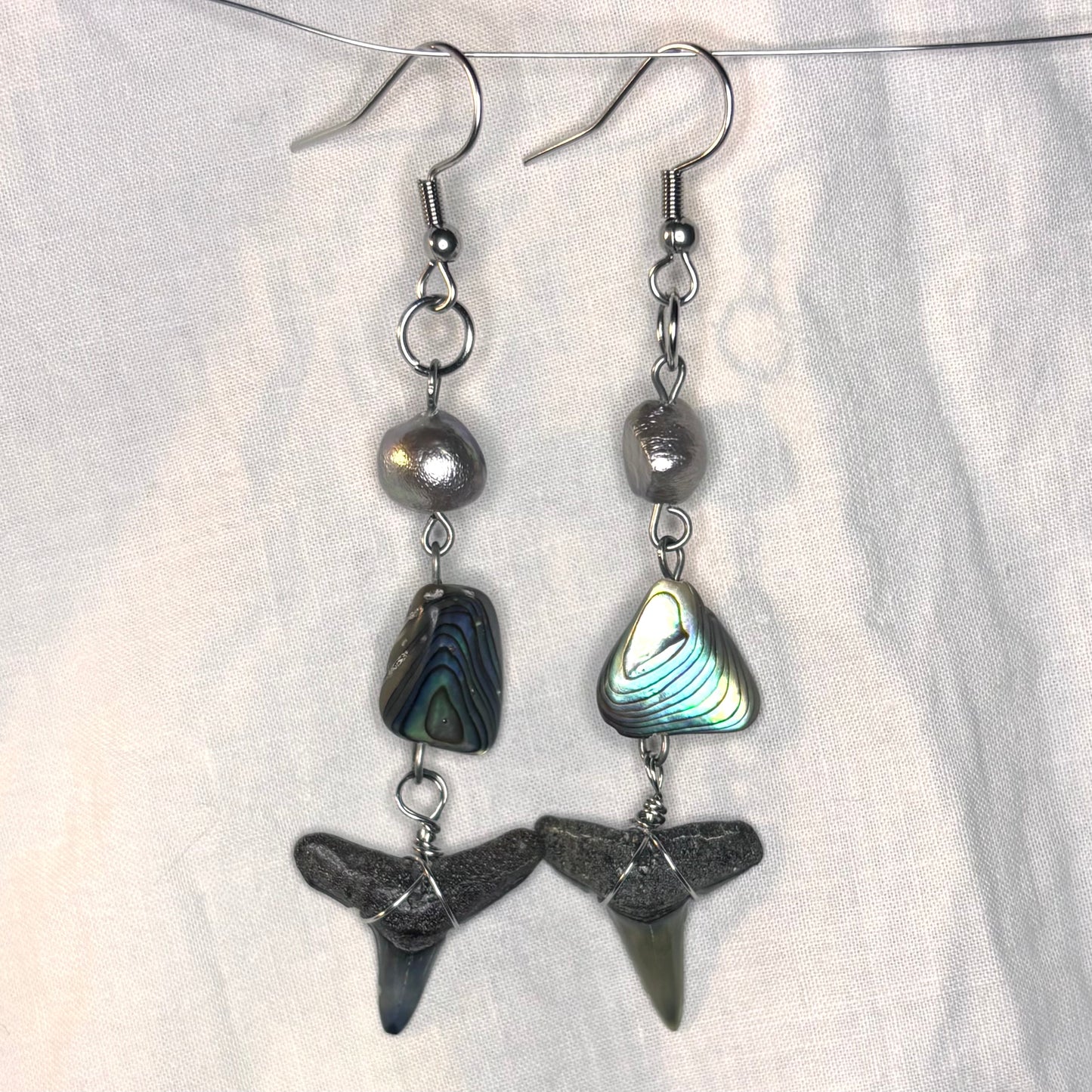 silver pearl, abalone, and shark tooth earrings