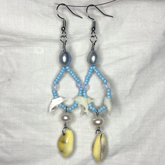 shell dolphin, pearl, and cowrie shell beaded loop earrings