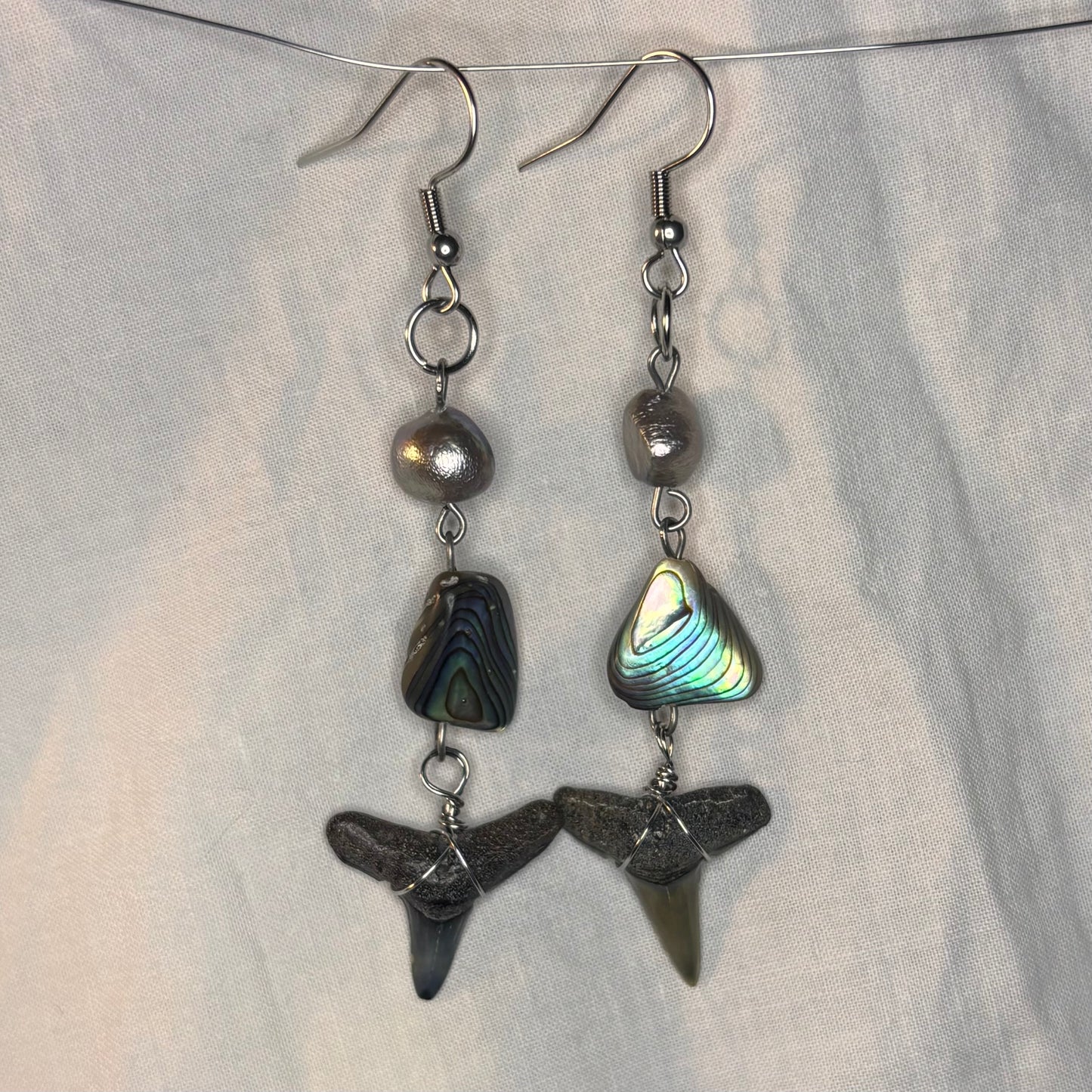 silver pearl, abalone, and shark tooth earrings